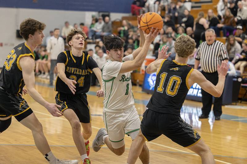 Rock Falls’ Austin Castaneda handles the ball in the lane against Riverdale Friday, Feb. 28, 2025, during the Class 2A Regional final at Bureau Valley High School.