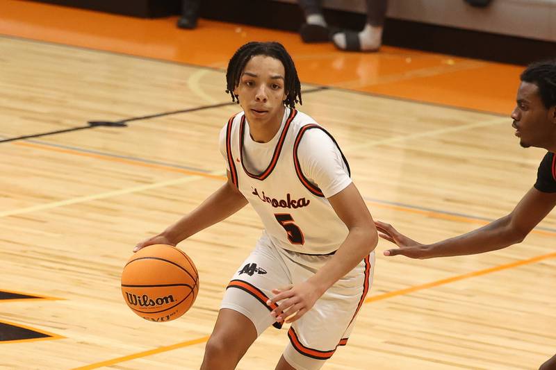 Minooka’s Jordan Freeman looks for a play against Bolingbrook on Tuesday, Dec. 17, 2024 in Minooka.