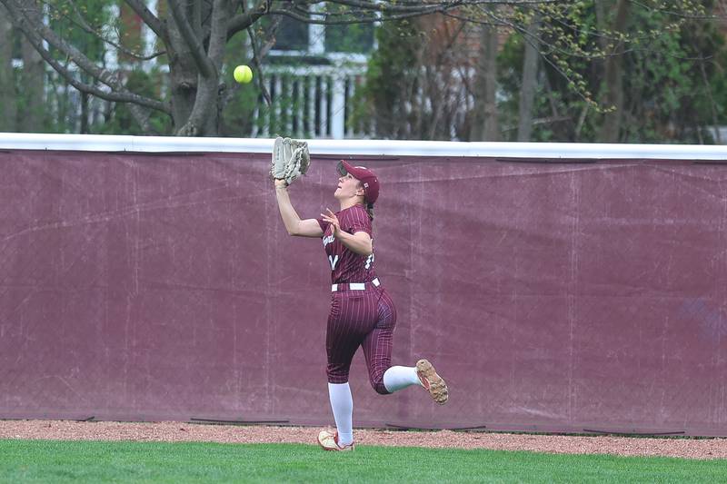 Lockport’s Taylor Lane runs down a fly ball at the warning tracks against Lincoln-Way East on Monday, April 13, 2026 in Lockport.