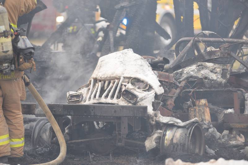 A burned out Jeep sits in a garage following a fire at 6727 W. Henry Road, southeast of Polo, on Wednesday, March 26, 2025. Several departments responded to the fire at the rural residence. In addition to the vehicle, a camper and other items located inside and around the garage were destroyed. No injuries were reported.