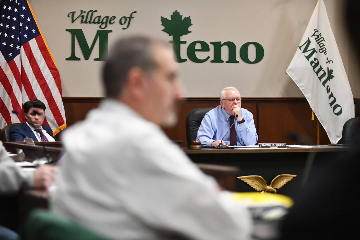 Manteno Mayor Tim Nugent and board members listens during public comment during the Manteno Village Board meeting on Dec. 18, 2023 at the Leo T. Hassett Community Center.