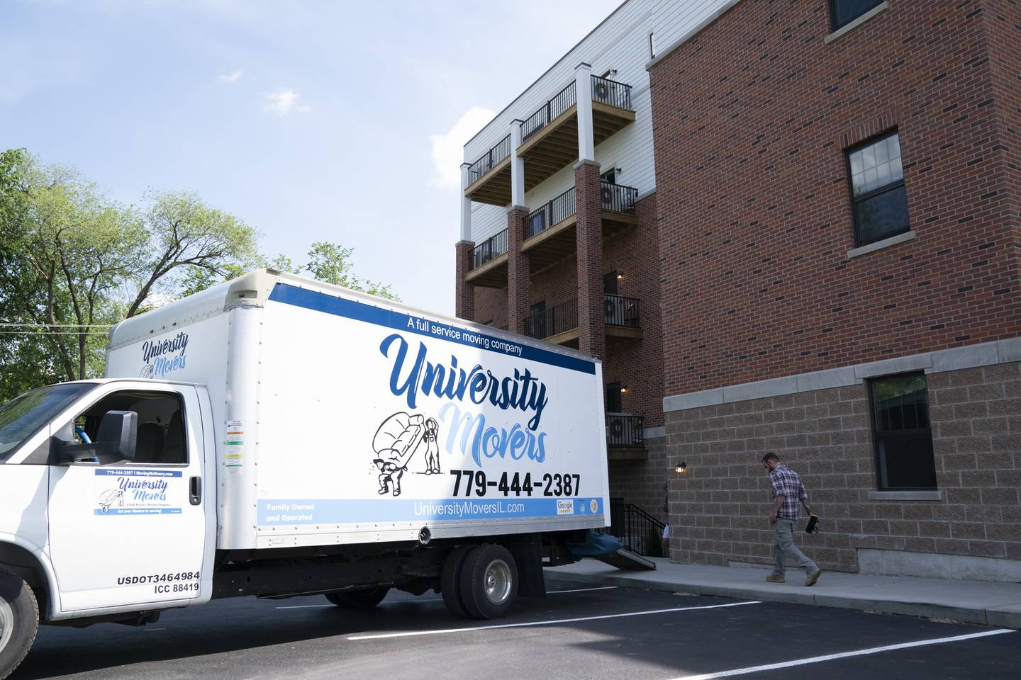Residents move into the newly built Woodstock Square Apartments on Madison and Church streets in Woodstock. Tenants began to move in this week to the 30-unit, five-story rental apartment complex.