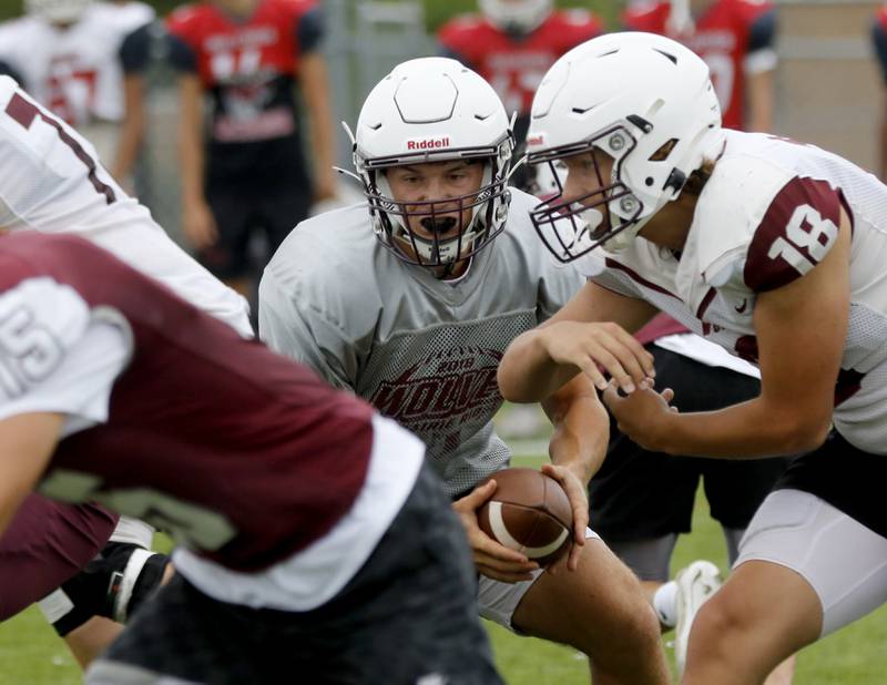 Prairie Ridge quarterback Luke Vanderwiel fakes a handoff during football practice against Grant on Thursday, July 17, 2025, at Grant High School in Fox Lake.