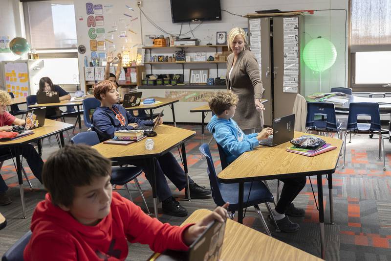Christine Murphy, grades six to eight English language arts teacher at East Coloma-Nelson, hands out treats to exceptional students Thursday, Nov. 13, 2025.