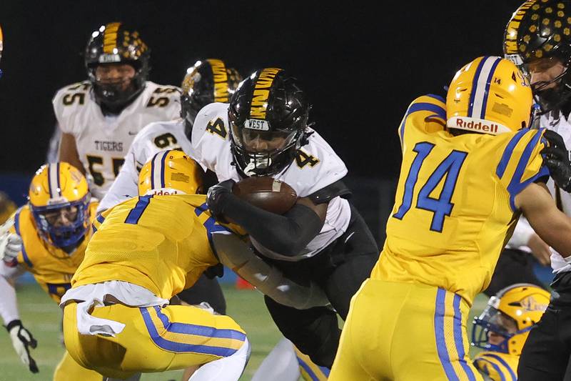 Joliet West’s Micah McNair powers ahead on a run against Lyons Township in the first round of the playoffs on Friday, Nov. 1, 2024 in La Grange.