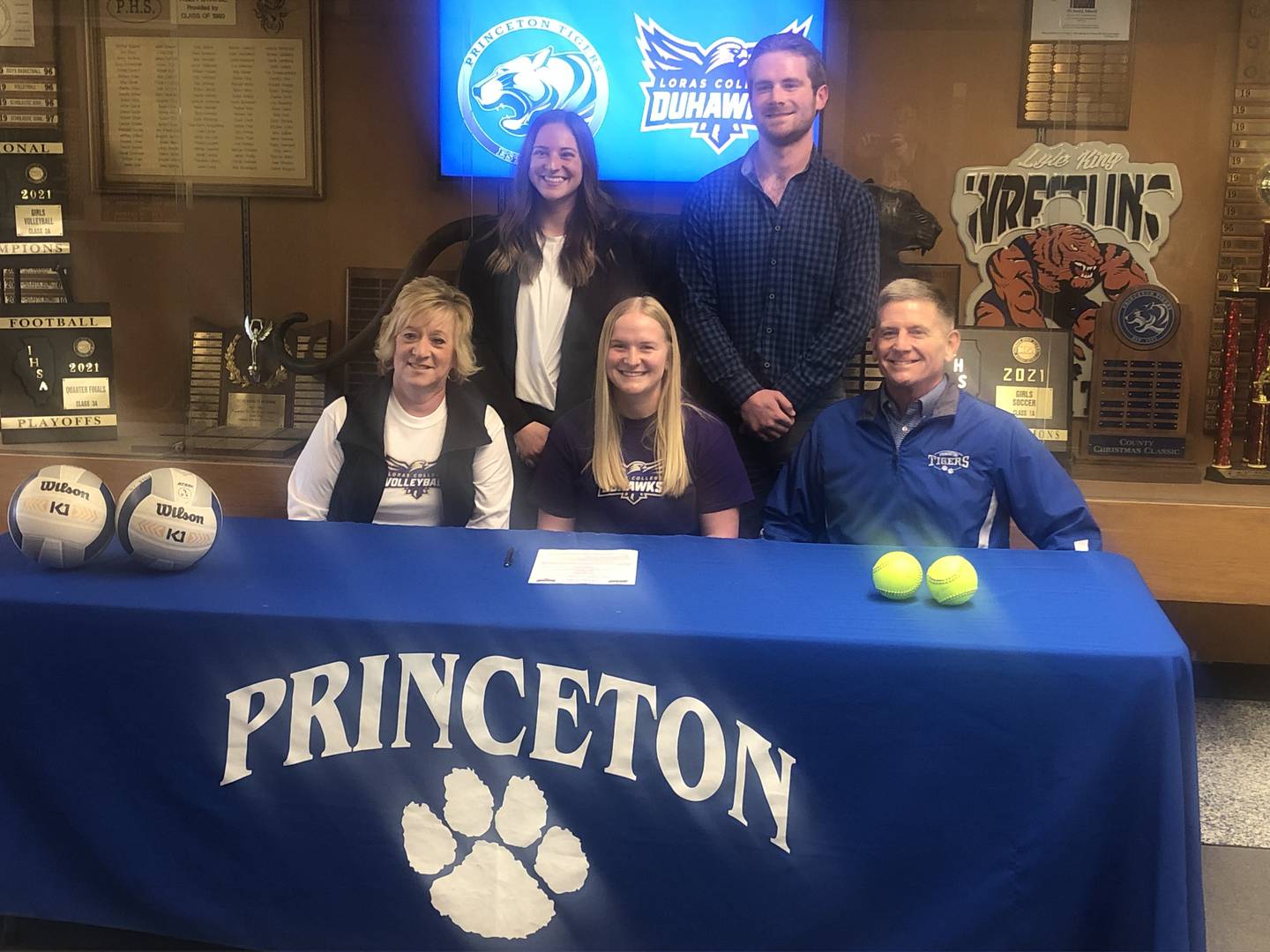 PHS senior Katie Bates signs Tuesday to play volleyball for Loras College. She will also play softball for the DuHawks. She was joined at her signing by her parents, (front) Jody and Joe Bates; and (bacK) her siblings Mollie and Levi.
