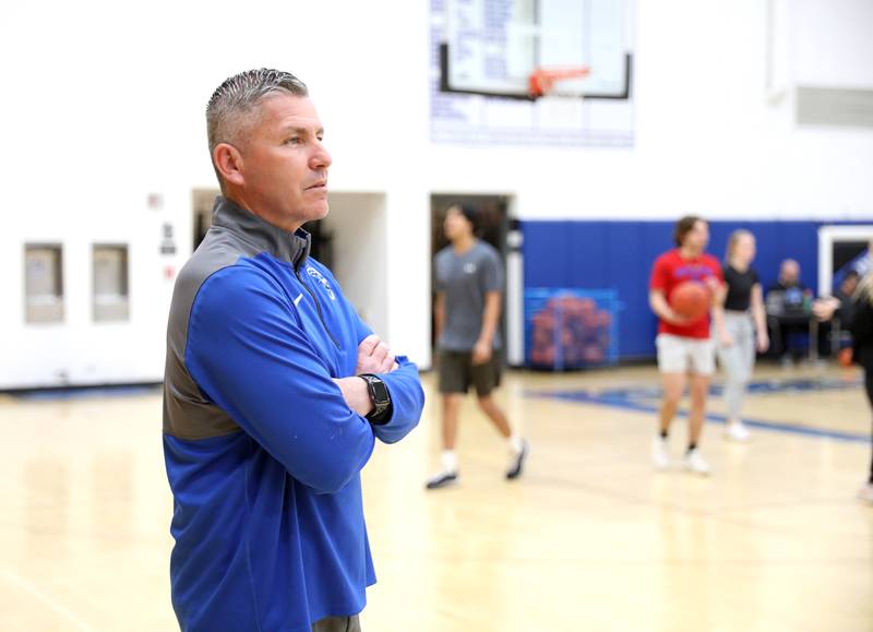 St. Charles North Head Baseball Coach Todd Genke as third-base coach during a recent game against Kaneland High School. Genke, who has been coaching the North Stars since 2004, also teaches driver’s education, health and physical education at the school.