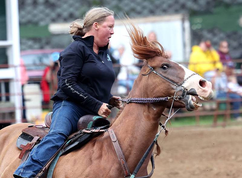 Jessica Williams and her horse compete in the barrel racing competition in the horse arena Wednesday, Sept. 3, 2025, on opening day of the Sandwich Fair.
