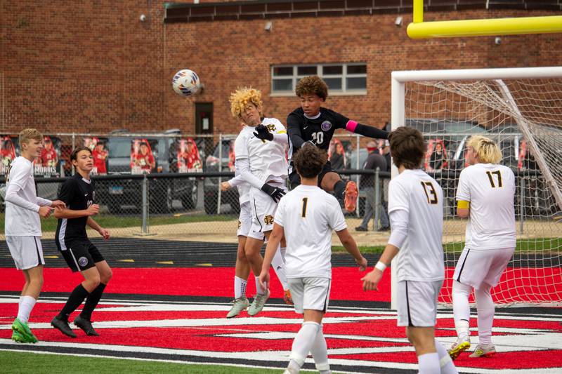 Manteno's Justin Foster competes for a header with a Reed-Custer player during Manteno's 3-0 victory in the Class 1A Momence Regional championship on Saturday, Oct. 25, 2025.