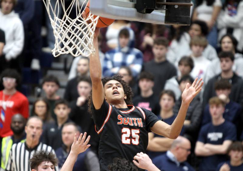 Wheaton Warrenville South’s Brayle Meredith gets a shot up during a game at Lake Park in Roselle on Friday, Feb. 10, 2023.