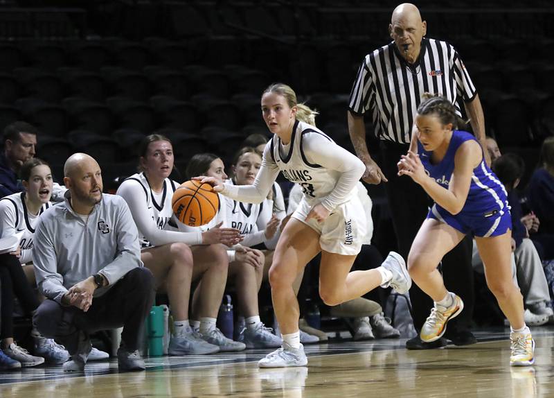 Cary-Grove's Malaina Kurth pushes the ball up the court as Burlington Central's Kelsey Covey chases during a Fox Valley Conference basketball game  on Tuesday, Jan. 14, 2025, at Now Arena in Hoffman Estates.