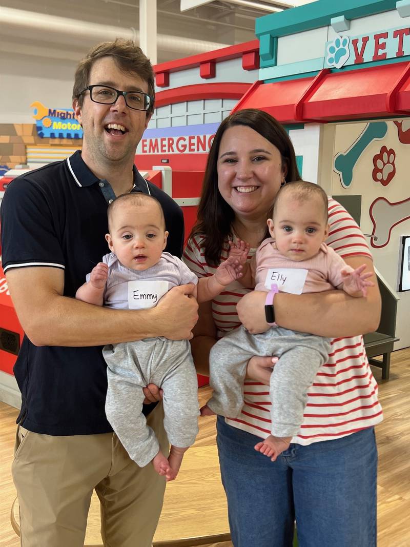 Eight-month-old twins Emmerson and Eloise (Emmy and Elly) Krause pose with their parents Bridget and Brandyn at the second reunion of graduates of Silver Cross Hospital's Amy, Matthew and Jay Vana Neonatal Intensive Care Unit and the babies’ immediate families on Sunday, Sept. 14, 2025 at the KidsWork Museum in New Lenox.