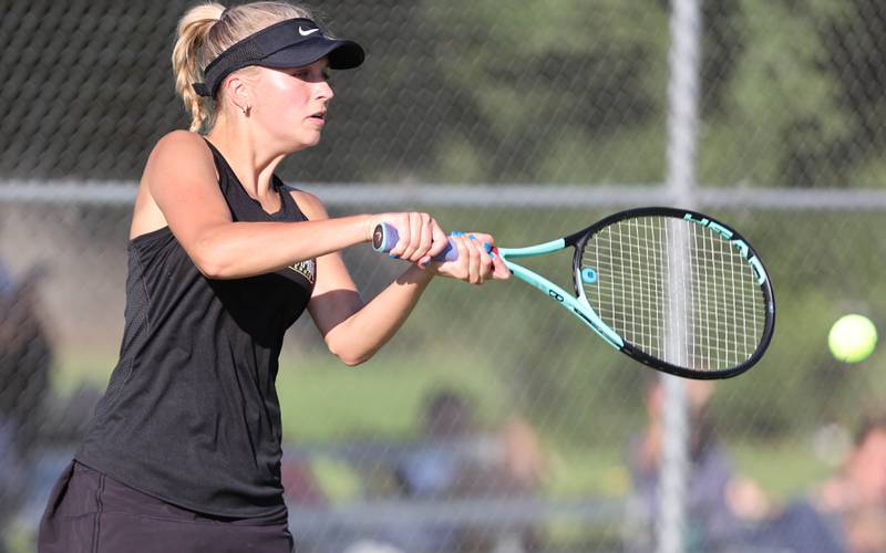 Sycamore's Jetta Weaver hits a backhand during a doubles match against DeKalb Monday, September 19, 2022, at Sycamore High School.