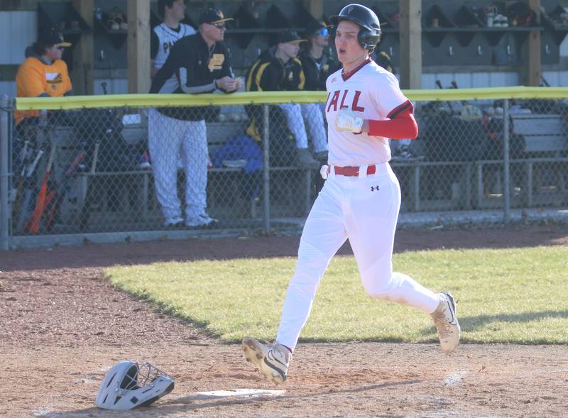 Hall's Jack Jabolnski steps on home plate to score the teams first run against Putnam County on Monday, March 17, 2025 at Putnam County High School.