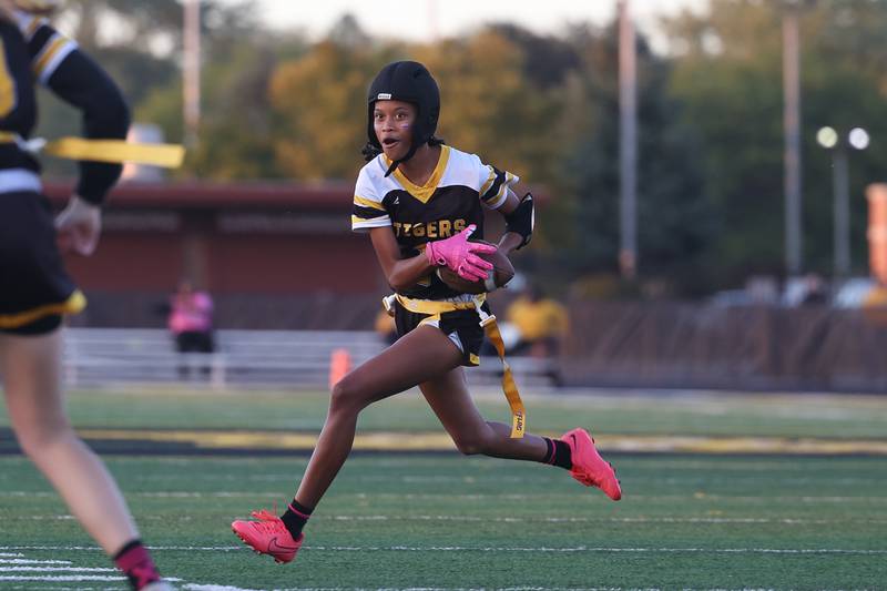 Joliet West’s Micaelah Simmons runs to the outside against Joliet Central on Wednesday, Oct. 2, 2024 in Joliet.