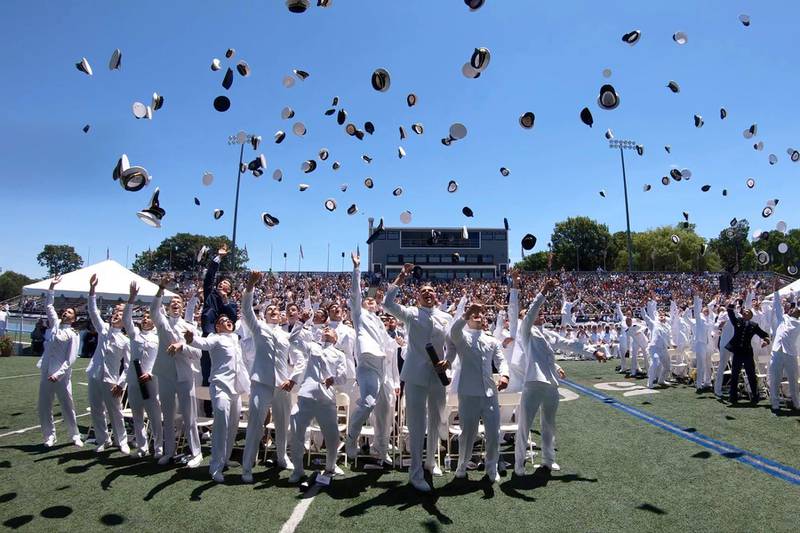 U.S. Merchant Marine Academy graduates celebrate at the end of their graduation ceremony in Kings Point, New York, on June 16, 2018.