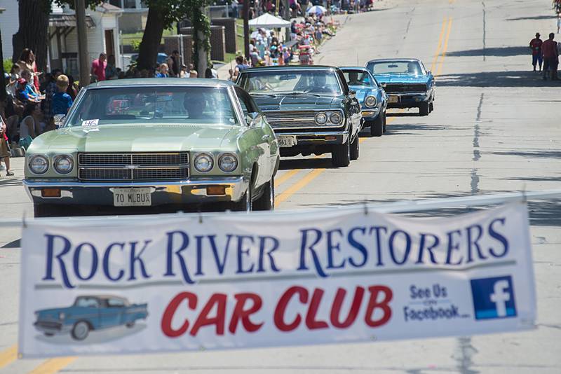 Classic muscle cars roll through the Petunia parade Sunday, July 3, 2022.