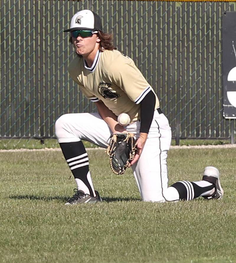 Sycamore's Collin Severson blocks a ball in the outfield during their game against Kaneland Thursday, May 4, 2023, at the Sycamore Community Sports Complex.