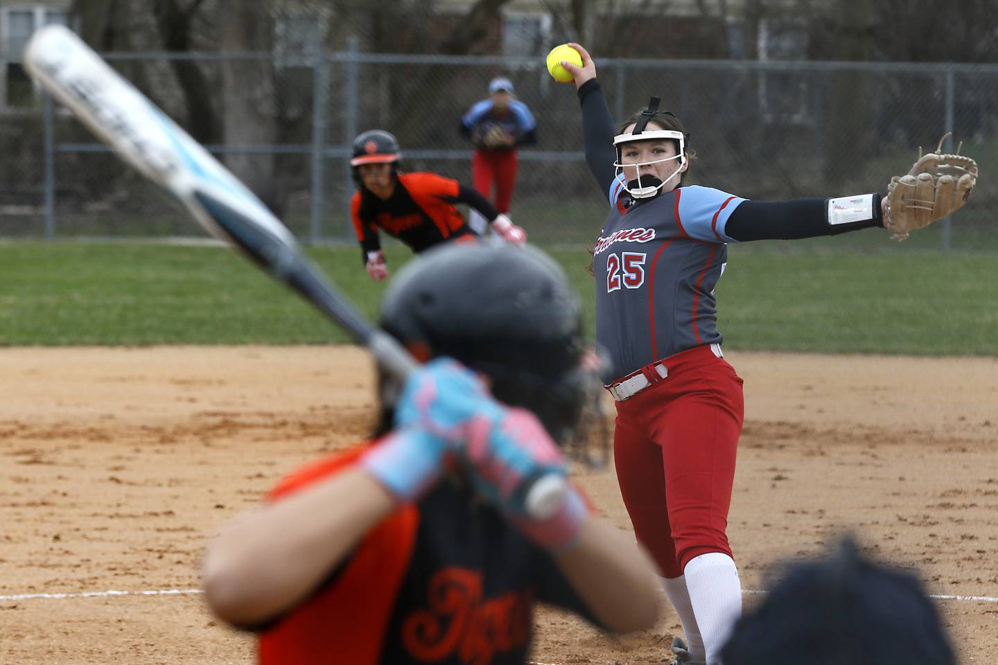 Marian Central's Christine Chmiel throws a pitch to Crystal Lake Central's Liv Shaw during a nonconference softball game on Thursday, April 3, 2025, at bates Park in Woodstock.