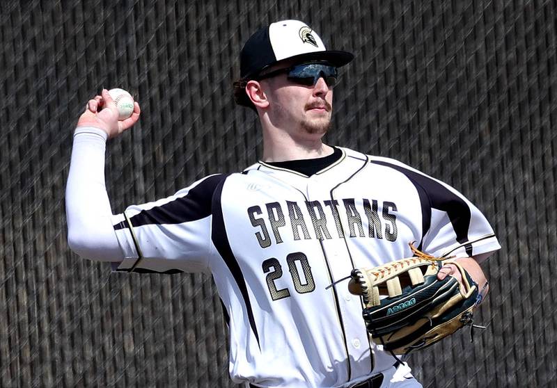 Sycamore's Devin Shaulis gets the ball back into the infield during their game against Byron Wednesday, March 26, 2025, at DeKalb High School. Sycamore’s home field was damaged in last week’s storms so today’s game was played on DeKalb’s field.