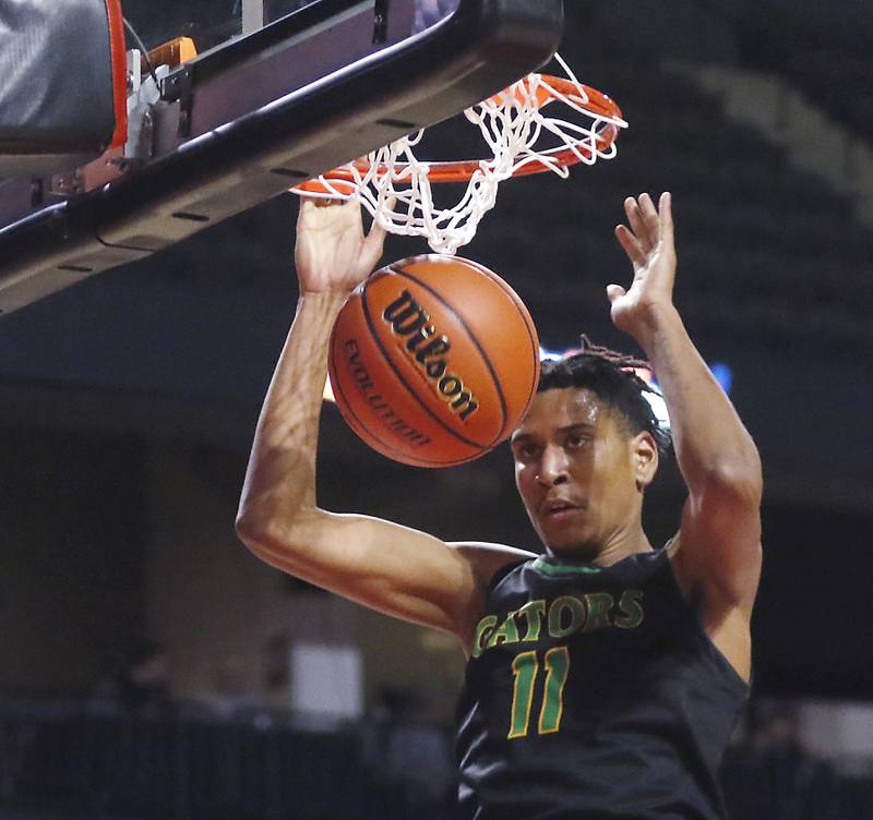 Crystal Lake South's Christian Rohde ducks the ball during the IHSA Class 3A Supersectional basketball game against DePaul College Prep on Monday, March 4, 2024, at NOW Arena in Hoffman Estates.