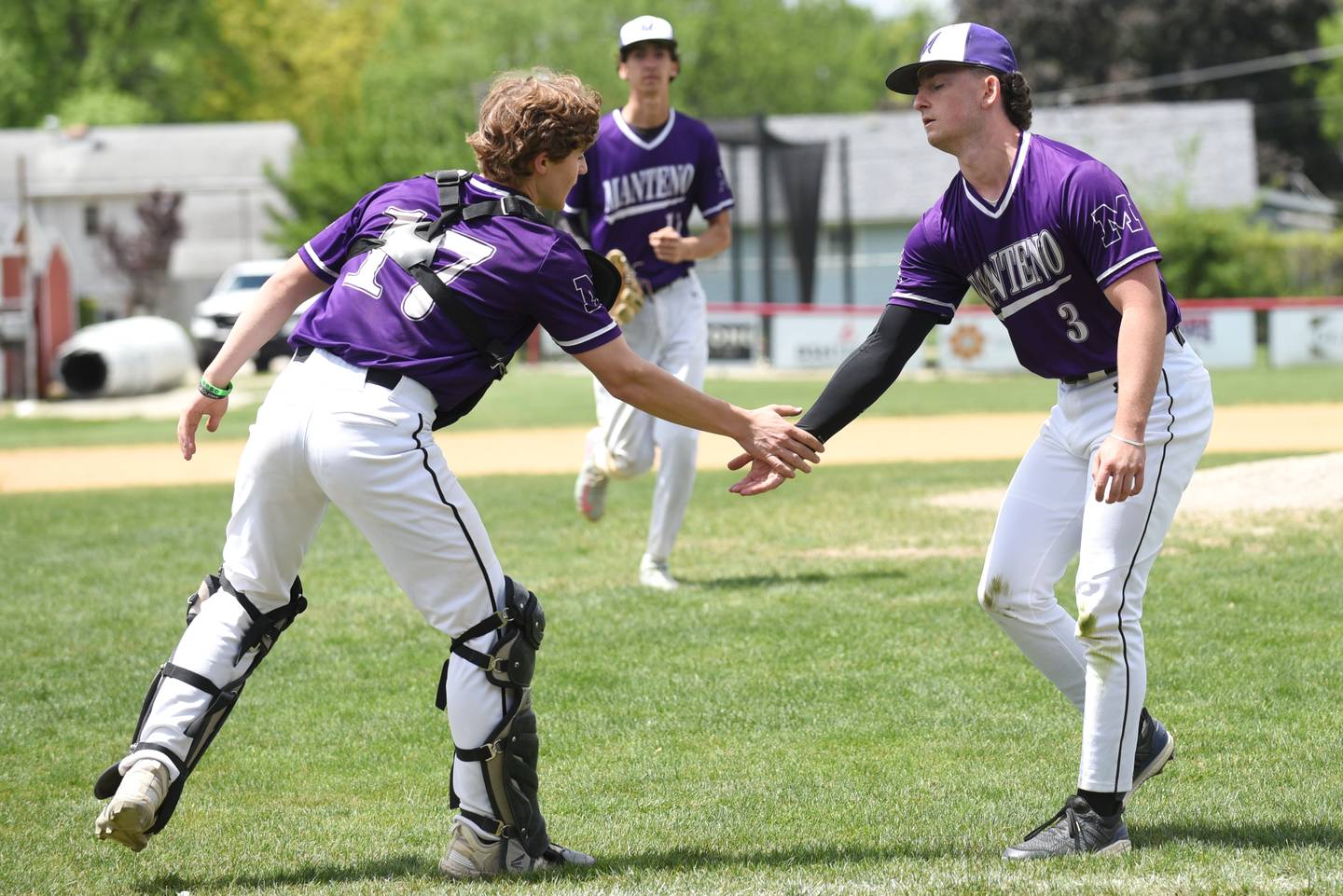 Manteno's Nolan Canfield, right, and Brady Hespen celebrate the Panthers' 6-1 win at Bradley-Bourbonnais Saturday, May 17, 2025.