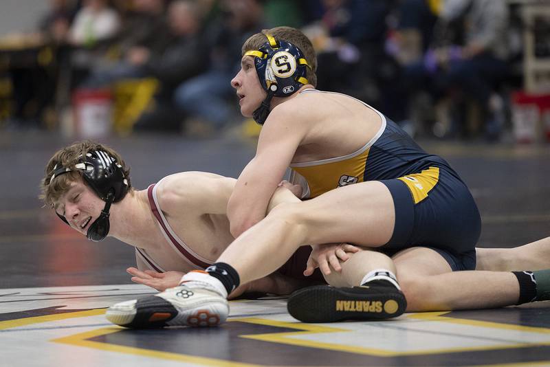 Sterling’s Cael Lyons works on Moline’s Weston Schradeya in the 126 pound class Friday, Jan. 31, 2025, during the Western Big 6 conference wrestling tournament held at Sterling High School.
