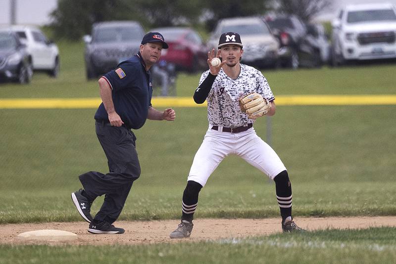 Marengo’s Michael Kirchoff barehands a hopper at third for an out against Newman Wednesday, May 28, 2025, in the Class 2A Sectional semifinal in Mendota.