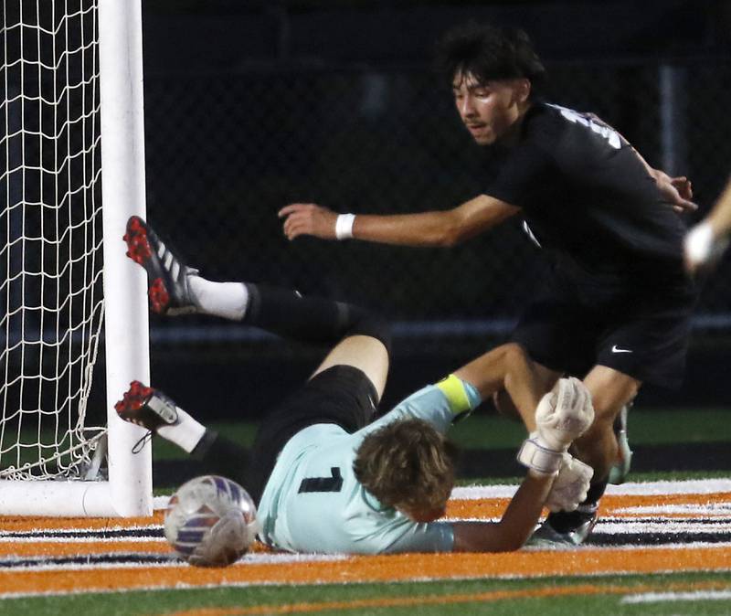 McHenry's Cole Tapia gets the ball past Prairie Ridge's Christopher Zinevich during a Fox Valley Conference boys soccer match on Tuesday, Sept. 30, 2025, at McCracken Field in McHenry.