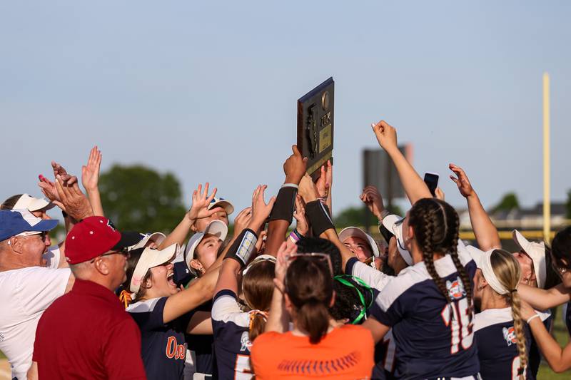 Oswego celebrates with the Class 4A Plainfield North Sectional plaque after defeating Wheaton North. May 31th, 2024.