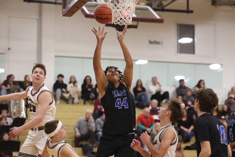 Lincoln-Way East’s Jaylin White puts up a shot against Lockport on Friday, Dec. 1, 2023 in Lockport.