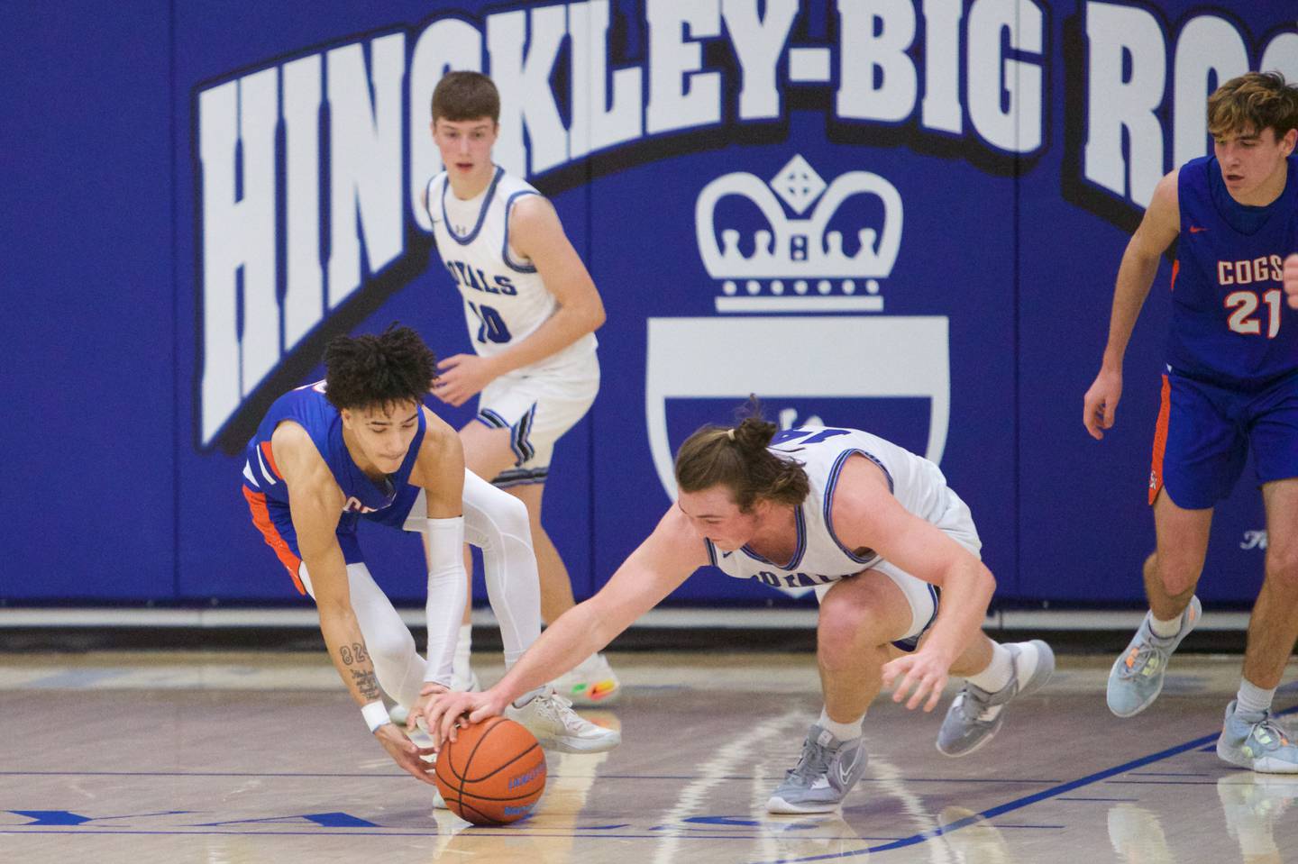 Genoa Kingston's Traven Atterberry battles for the loose ball with Hinkley Big Rock's Martin Ledbetter on Thursday, Dec.8,2022 in Hinkley.