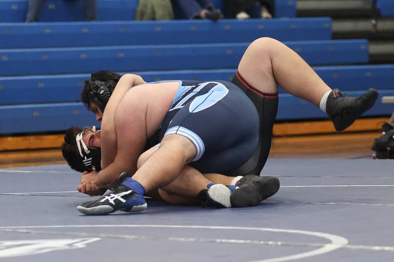 Plainfield South’s Ian Portillo drops Plainfield North’s Liam Corona in a Southwest Prairie dual meet on Wednesday, Nov. 29, 2023 in Plainfield.