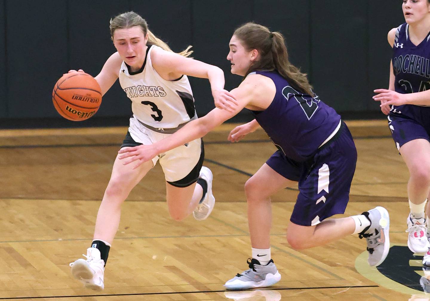 Kaneland's Alexis Schueler pushes the ball up the court against Rochelle's Alivia Henkel during their Class 3A regional semifinal game Tuesday, Feb. 14, 2023, at Sycamore High School.