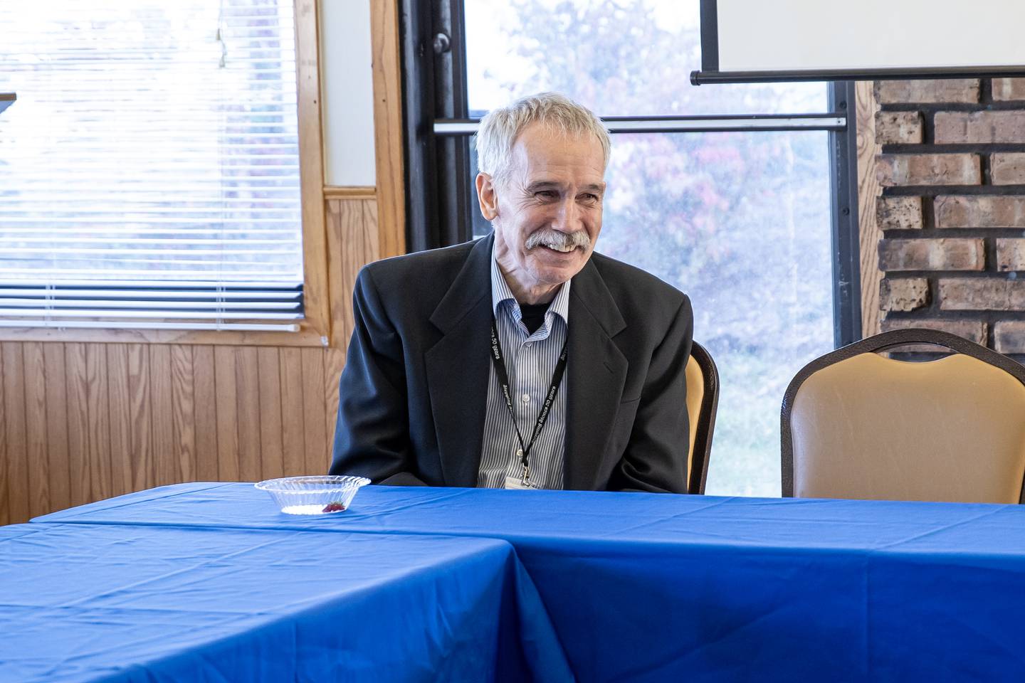 Former Stepping Stones executive director Paul Lauridsen engages in a discussion about addiction and recovery services at Stepping Stones on Oct. 30, 2025.