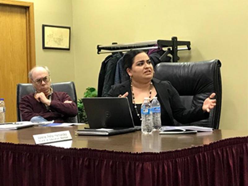 DeKalb School District 428 Board member Valerie Pena-Hernandez asks about funding and principal support for school improvement plans for low performing schools in the district at Tuesday board meeting.