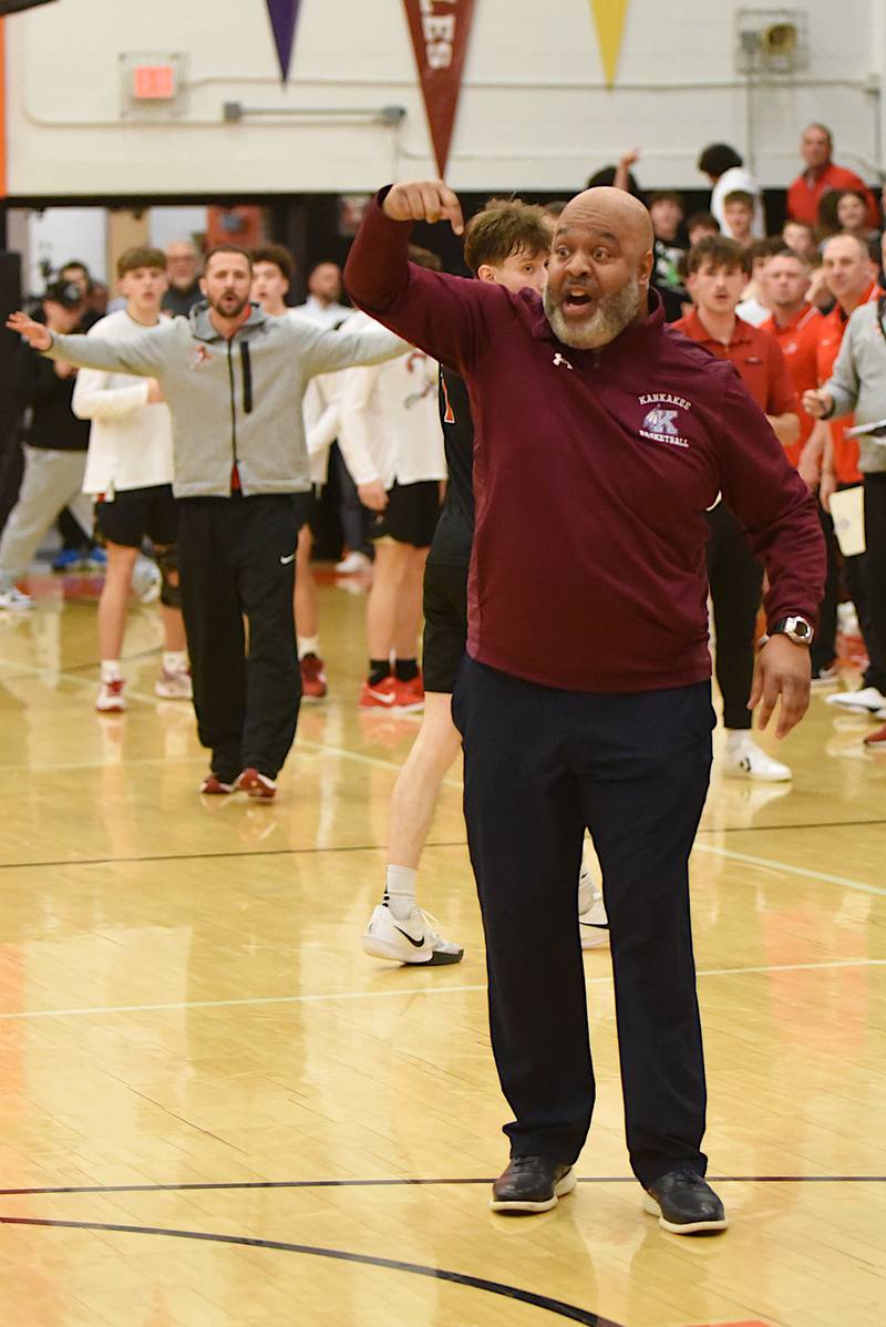 Kankakee boys basketball coach Chris Pickett, foreground, gestures to the officials to count a late basket from the Kays' Myair Thompson as Metamora head coach Justin Dehm encourages it to not be counted after the buzzer sounded to end regulation of the IHSA Class 3A Washington Sectional semifinals Tuesday, March 4, 2025.