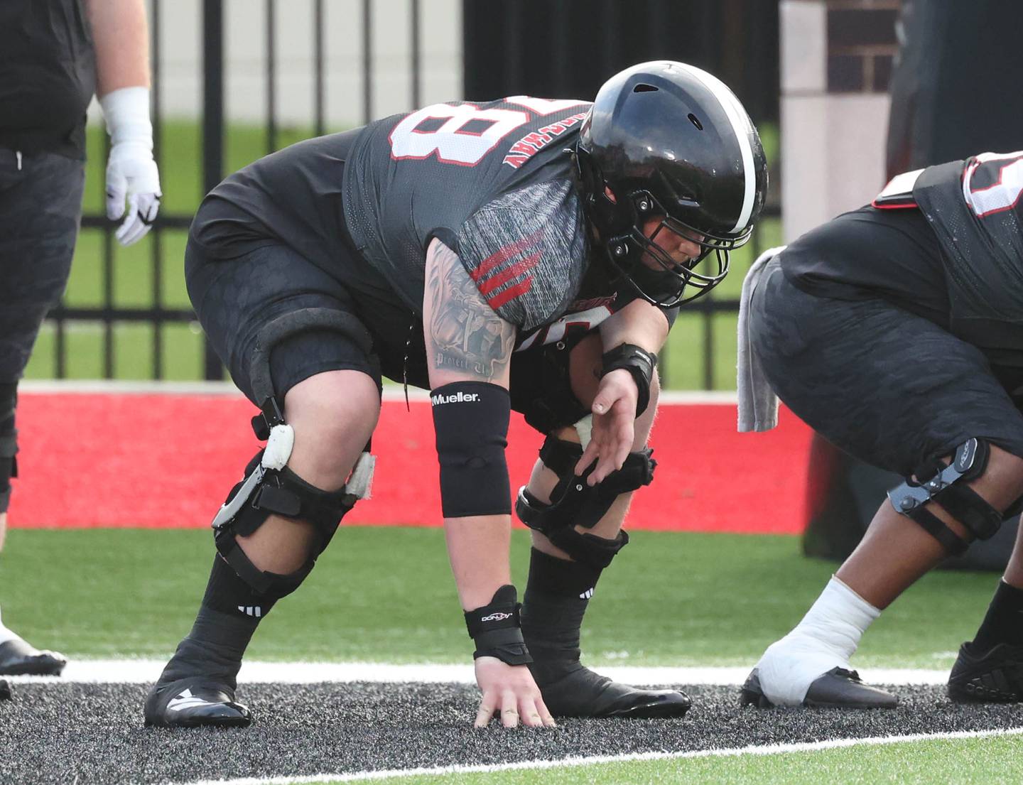 Northern Illinois University offensive lineman Jacob Welch gets into his stance Tuesday, April 14, 2026, during a drill at spring practice in Huskie Stadium at NIU in DeKalb.