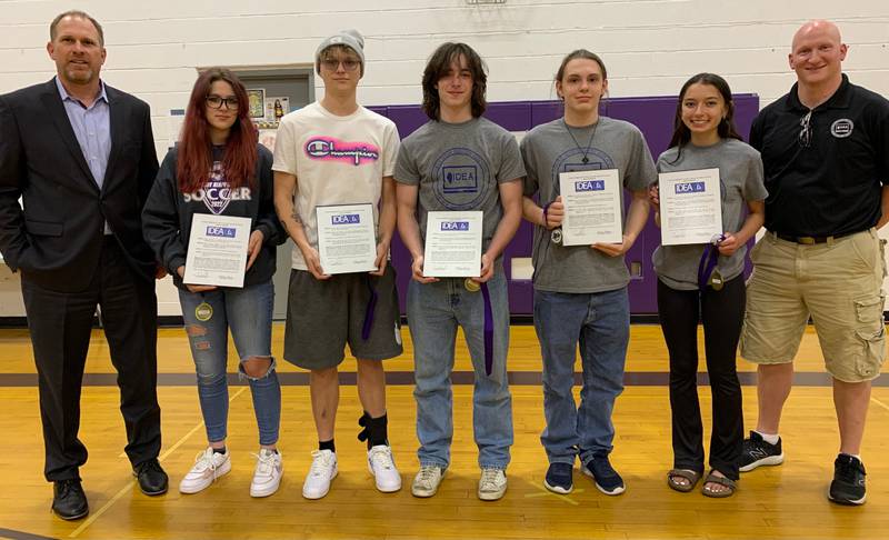 Students who competed in the IDEA were presented with a framed resolution and medallion to celebrate their success. Pictured fro left are Superintendent Tony Baker, Hailey Shatters, Conner Lupa, Vincent Herbig, Jon Foster, Ava DeBolt and Joe Kampf, PHS Technology & Engineering teacher.