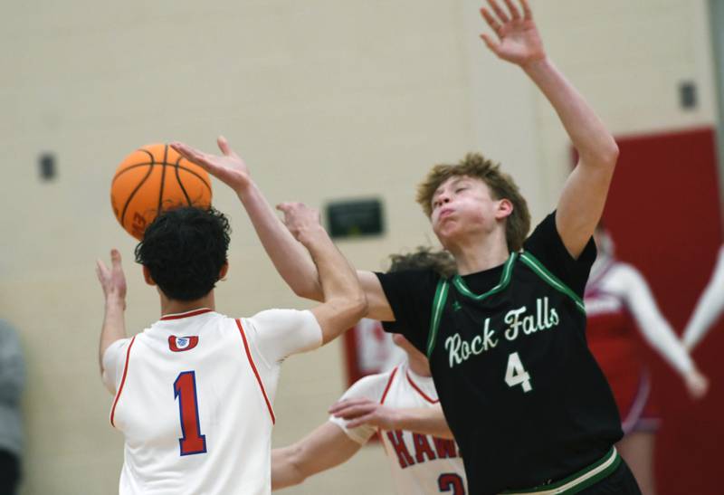 Oregon's Benny Olalde (1) and Rock Falls' Connor South (4) collide as they reach for a loose ball on Friday, Jan. 9, 2026 at the Blackhawk Center in Oregon.