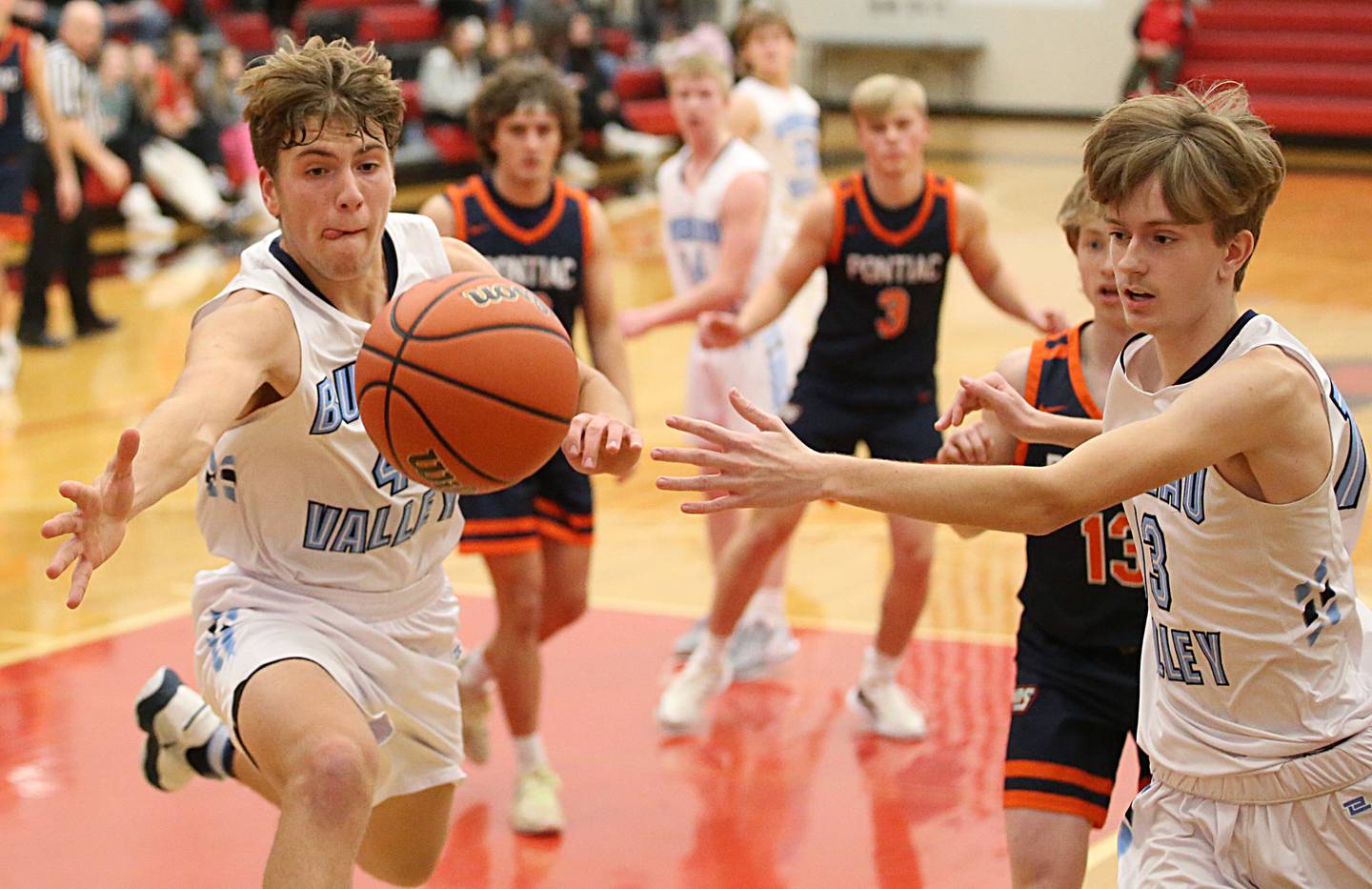 Bureau Valley's Landon Hulsing (4) and teammate Parker Stier (13) fail to recover the ball as it goes out of bounce during the Colmone Classic tournament on Monday, Dec. 5, 2022 at Hall High School in Spring Valley.