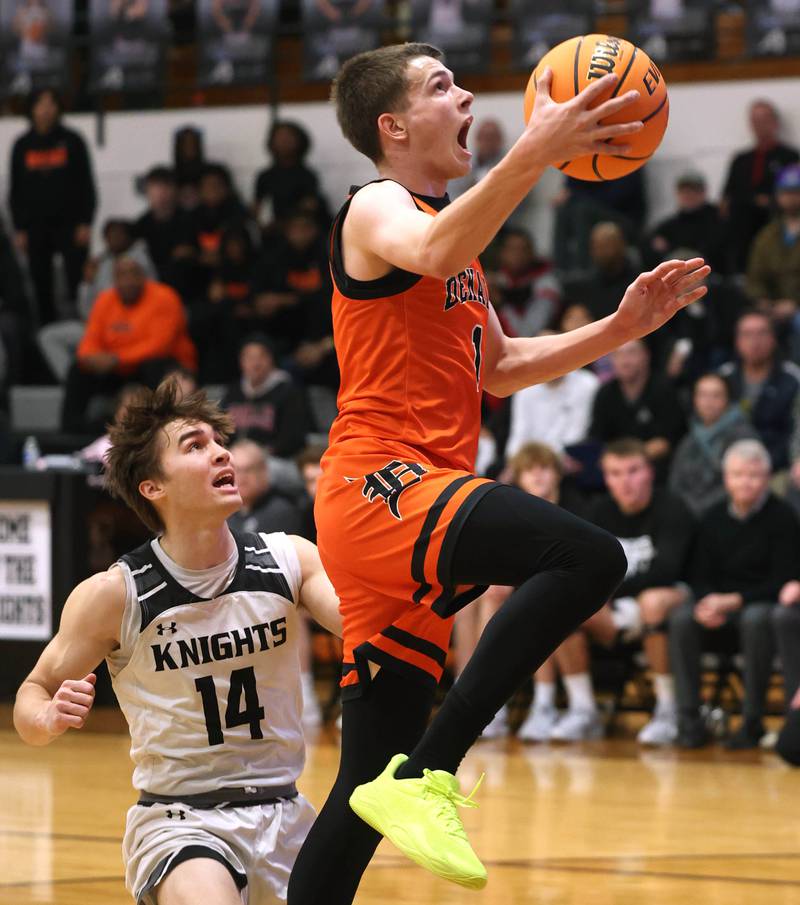 DeKalb's Jackson Kees gets a layup in front of Kaneland's Preston Popovich during their game Tuesday, Jan. 28, 2025, at Kaneland High School in Maple Park.
