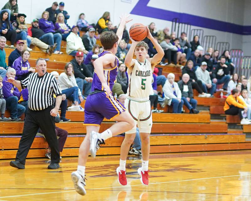 La Salle-Peru's Seth Adams (5) shoots a 3-pointer over Mendota’s Aden Tillman (22) during a first-round game in the 60th Plano Christmas Classic on Wednesday, Dec 27, 2023.