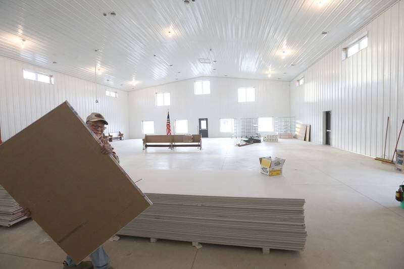 Jeff VanAutreve moves a piece of dry wall inside the Second Story Teen Center on Wednesday, Dec. 12, 2024 in Princeton. Construction is coming along quite nicely. Work is expected to be completed in the Spring of 2025. The center is $250,000 short of completing the project. They are asking the community for donations. Every week, Second Story Teen Center provides meals, mentorship, and a safe place for approximately 150 teens to gather, grow, and thrive. Over the years, the center has been instrumental in fostering positive change in the community, contributing to a decline in teen suicide rates and teen theft.
