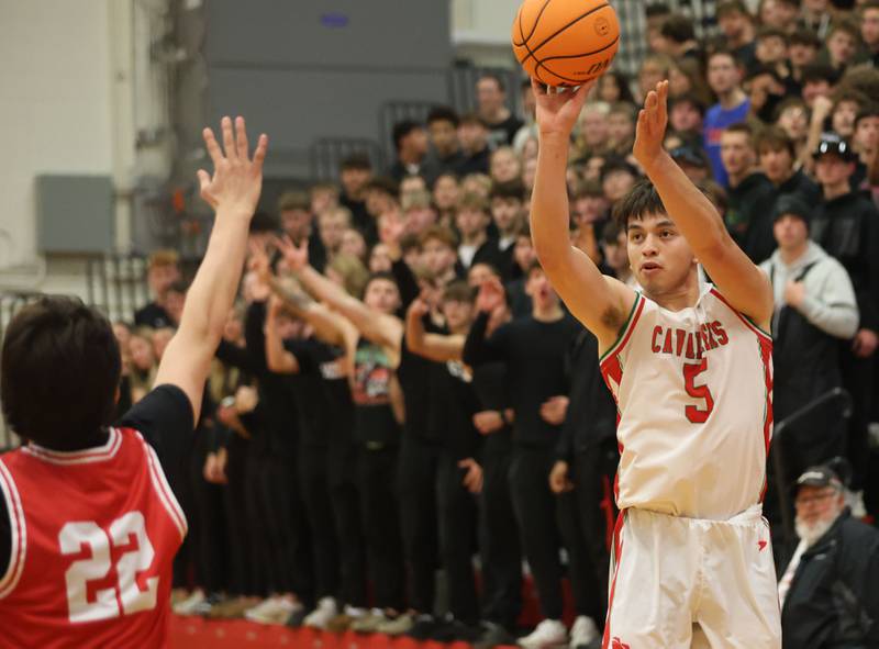 L-P's Erick Sotelo shoots a jump shot over Ottawa's Dominic Parks on Friday, Jan. 9, 2026 in Sellett Gymnasium at L-P High School.