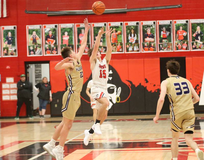 Earlville's Trenton Fruit scores a half-court shot buzzer beater over Serena's Beau Raikes on Friday, Feb. 9, 2024 at Earlville High School.