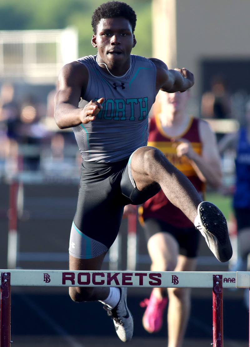 Woodstock North’s Dominion Okwong crosses the final hurdle in the 300-meter hurdles in KRC Conference Track Meet action at Richmond-Burton High School in Richmond on Tuesday, May 13, 2025.