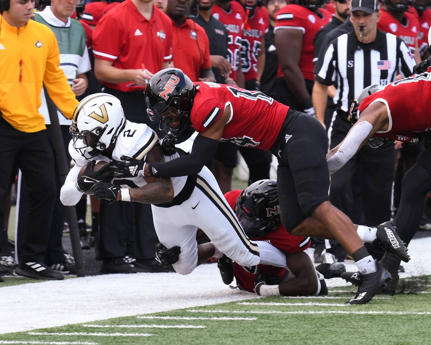 Northern Illinois Huskies Jorden Gandy (14) pushes out Vanderbilt ball carrier in the first quarter Saturday Sep. 17th at Huskie Stadium in DeKalb.