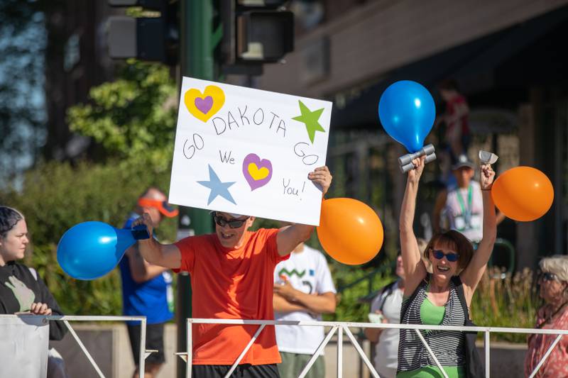 Bill, left, and Kathy Bliler of Lake in the Hills cheer on their daughter Dakota Bliler as she crosses the finish line at the Fox Valley Marathon on Sunday, Sept. 18, 2022. Dakota Bliler finished the race as the first female marathon finisher.