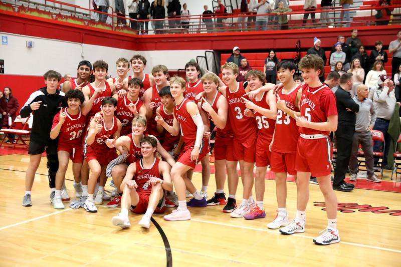 Hinsdale Central players celebrate their win over Brother Rice during the Hinsdale Holiday Classic championship game on Monday, Dec. 30, 2024 in Hinsdale.